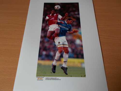 Press photo--Anelka (Arsenal) and Materazzi (Everton) action 13-3-1999    (PH245)